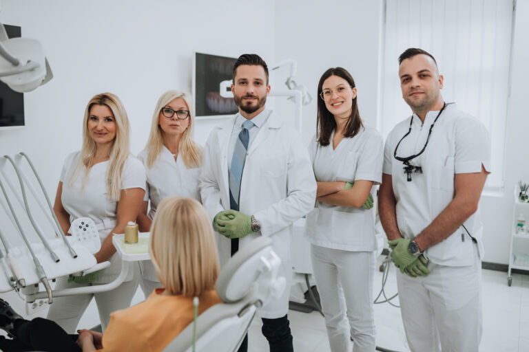 Beautiful young blond woman having dental treatment at dentist's office.